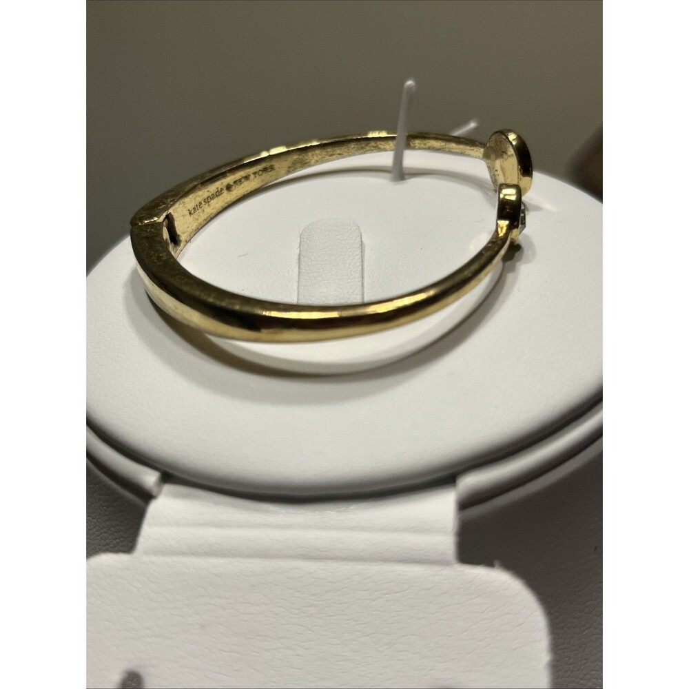 Kate Spade New York Spot The Spade Gold Tone White Enamel Hinged Cuff Bracelet - Picture 4 of 5